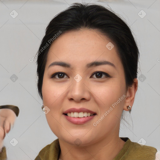 Joyful asian young-adult female with medium  brown hair and brown eyes