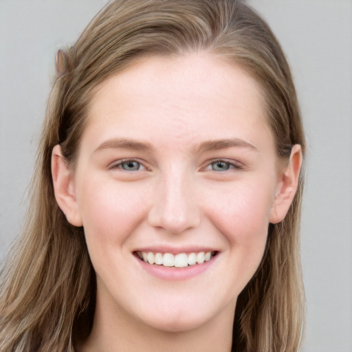 Joyful white young-adult female with long  brown hair and grey eyes