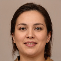 Joyful white young-adult female with medium  brown hair and brown eyes