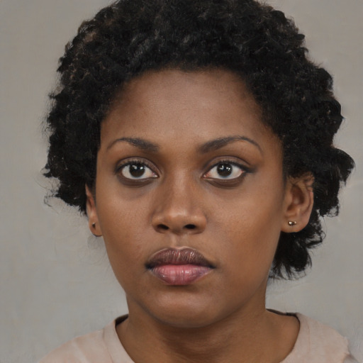 Neutral black young-adult female with short  black hair and brown eyes