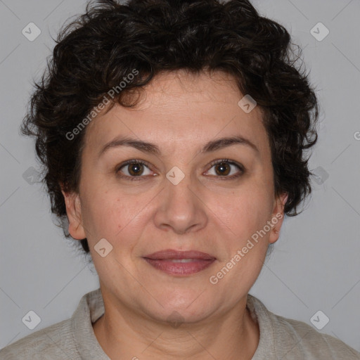 Joyful white adult female with short  brown hair and brown eyes