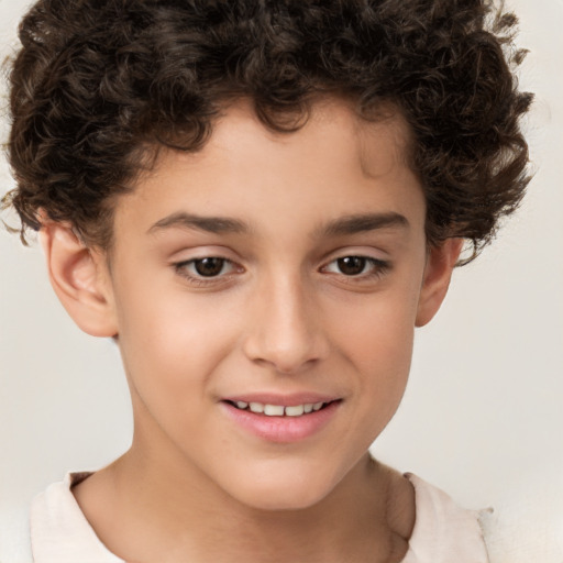 Joyful white child male with short  brown hair and brown eyes