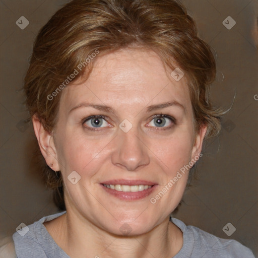 Joyful white adult female with medium  brown hair and blue eyes