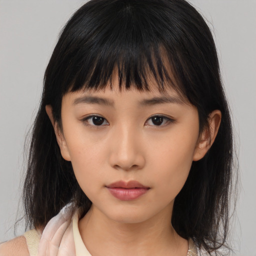 Neutral asian young-adult female with medium  brown hair and brown eyes