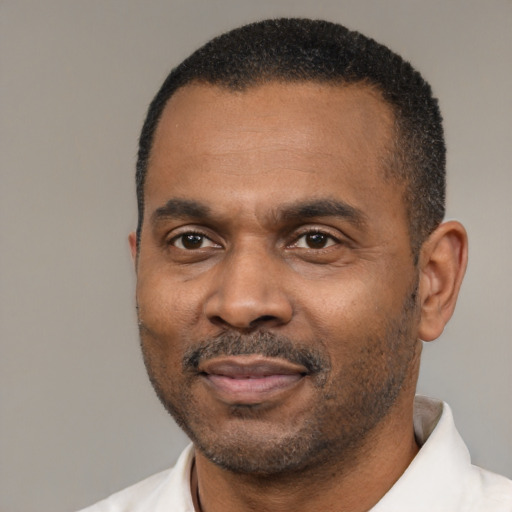 Neutral latino adult male with short  black hair and brown eyes