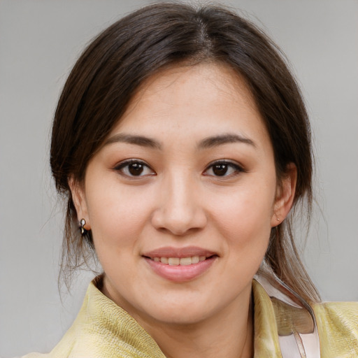 Joyful white young-adult female with medium  brown hair and brown eyes
