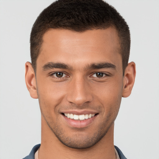 Joyful white young-adult male with short  brown hair and brown eyes