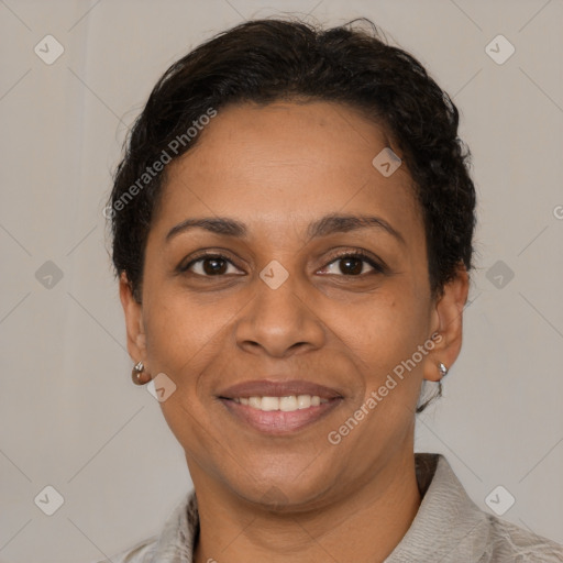 Joyful latino adult female with short  brown hair and brown eyes