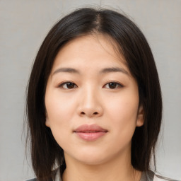 Neutral asian young-adult female with medium  brown hair and brown eyes