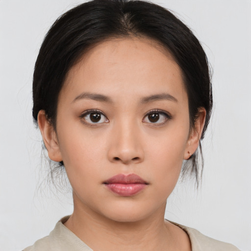 Neutral asian young-adult female with medium  black hair and brown eyes