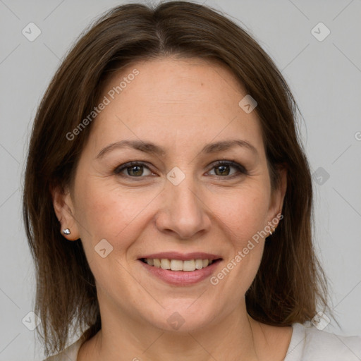 Joyful white adult female with medium  brown hair and grey eyes