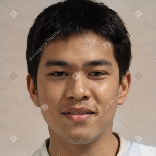 Joyful asian young-adult male with short  black hair and brown eyes