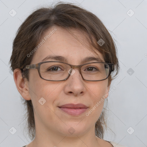 Joyful white adult female with medium  brown hair and brown eyes