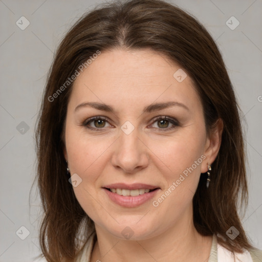 Joyful white adult female with medium  brown hair and brown eyes