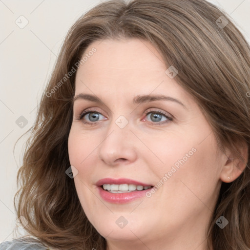 Joyful white young-adult female with medium  brown hair and blue eyes