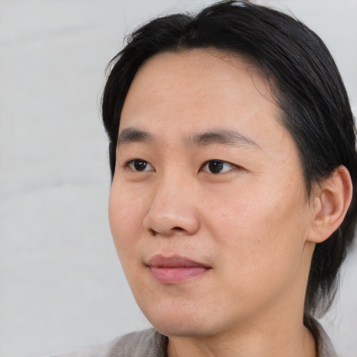 Neutral asian adult male with short  black hair and brown eyes