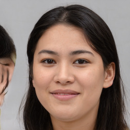 Joyful asian young-adult female with medium  brown hair and brown eyes