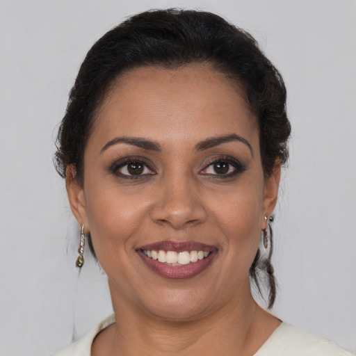 Joyful white young-adult female with medium  brown hair and brown eyes