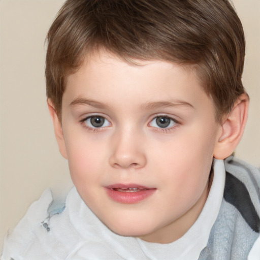 Joyful white child male with short  brown hair and brown eyes