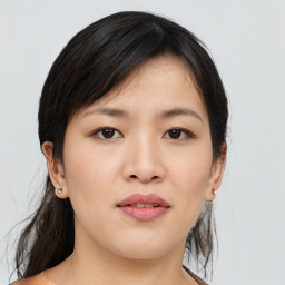 Joyful asian young-adult female with medium  black hair and brown eyes