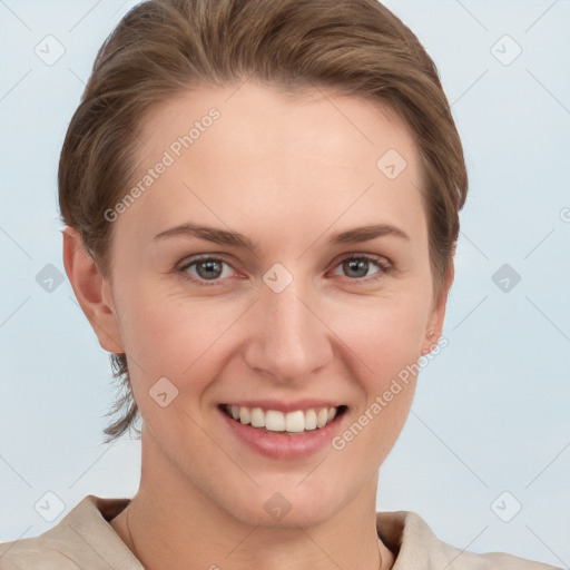 Joyful white young-adult female with short  brown hair and grey eyes