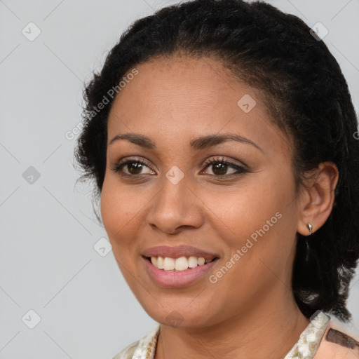 Joyful latino young-adult female with medium  brown hair and brown eyes