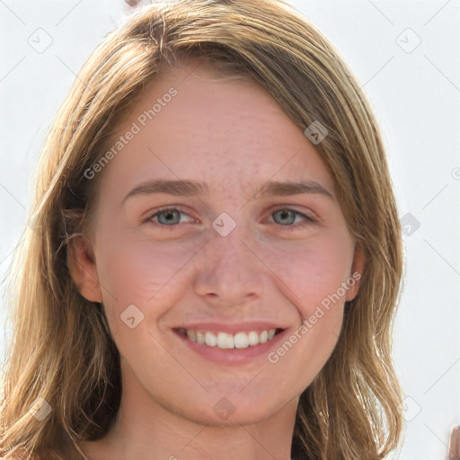 Joyful white young-adult female with long  brown hair and blue eyes