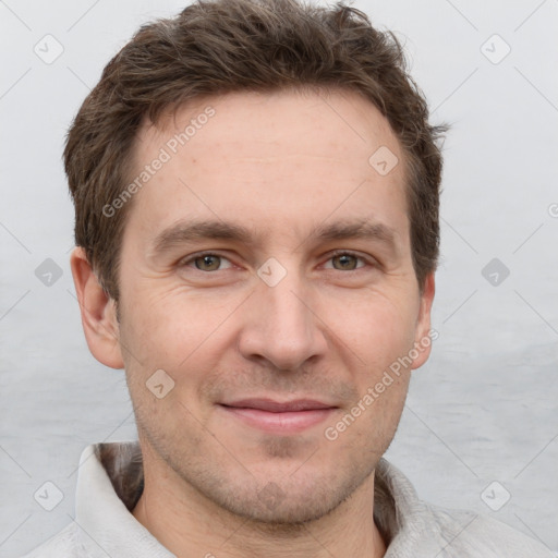 Joyful white adult male with short  brown hair and grey eyes