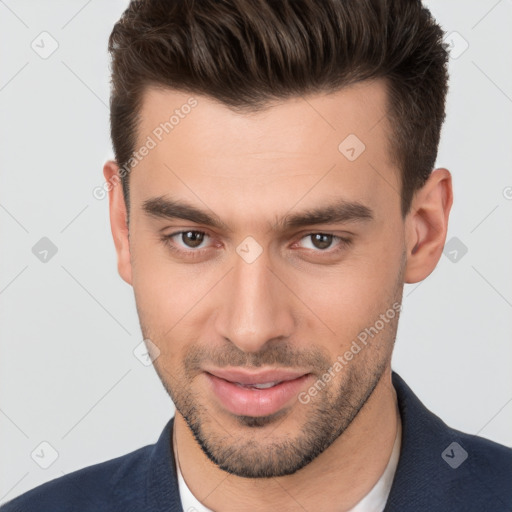 Joyful white young-adult male with short  brown hair and brown eyes