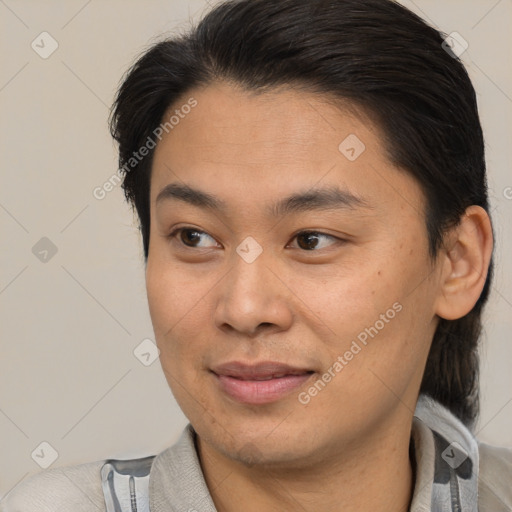 Joyful asian young-adult male with short  brown hair and brown eyes