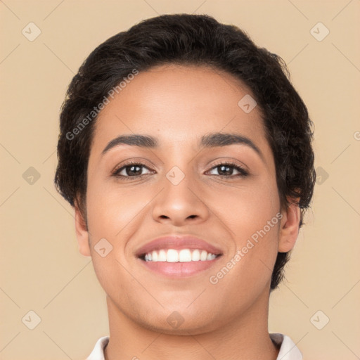 Joyful latino young-adult female with short  brown hair and brown eyes