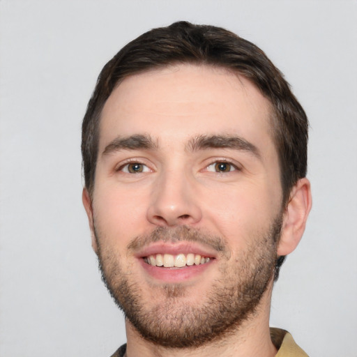 Joyful white young-adult male with short  black hair and brown eyes