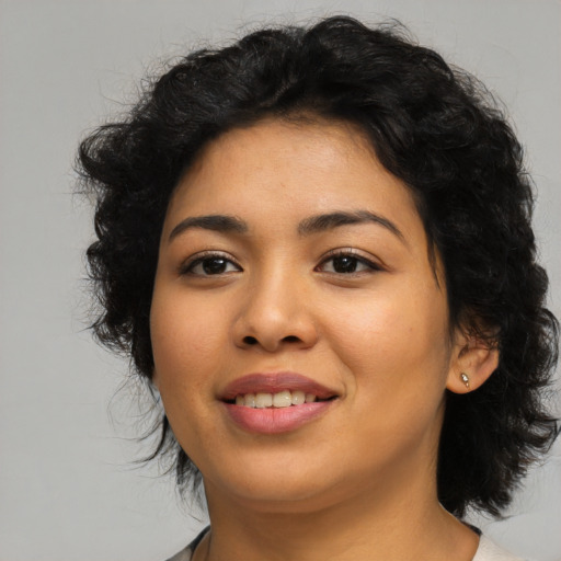 Joyful asian young-adult female with medium  black hair and brown eyes