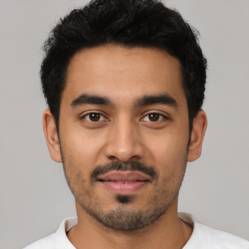 Neutral latino young-adult male with short  black hair and brown eyes