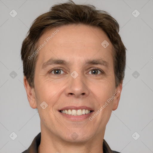 Joyful white adult male with short  brown hair and grey eyes