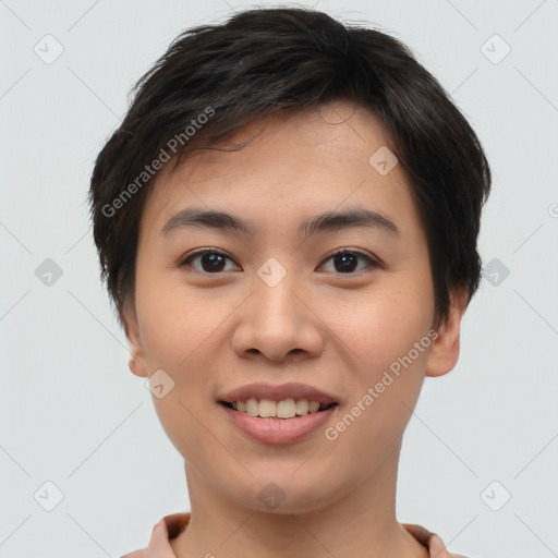 Joyful asian young-adult female with short  brown hair and brown eyes