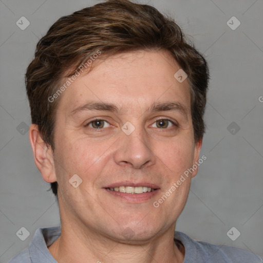 Joyful white adult male with short  brown hair and grey eyes