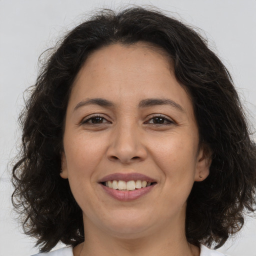 Joyful asian adult female with medium  brown hair and brown eyes