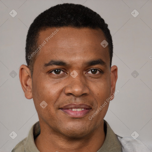 Joyful black young-adult male with short  black hair and brown eyes