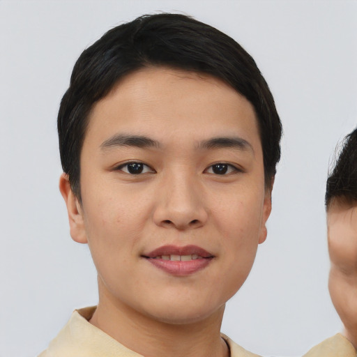 Joyful asian young-adult female with short  black hair and brown eyes