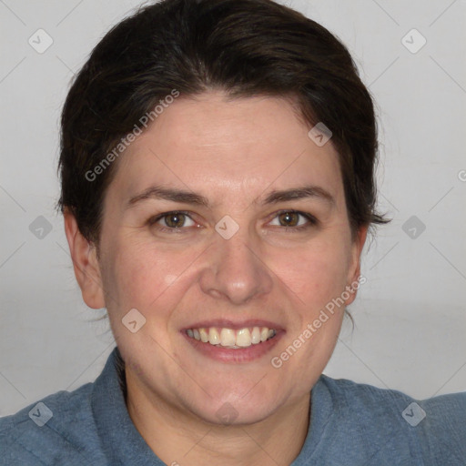 Joyful white adult female with short  brown hair and brown eyes