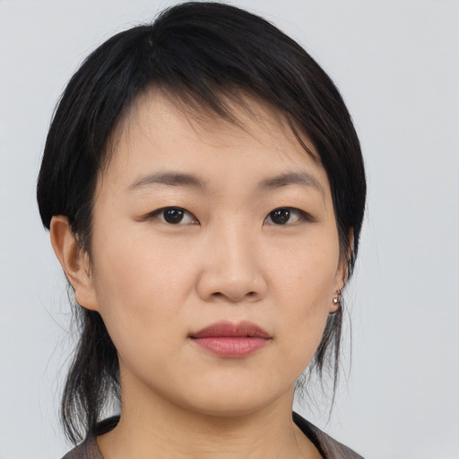 Neutral asian young-adult female with medium  black hair and brown eyes