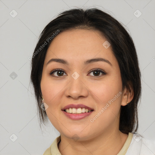 Joyful latino young-adult female with medium  brown hair and brown eyes