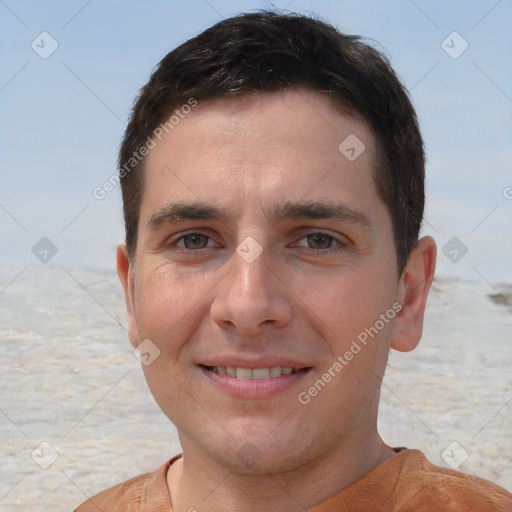 Joyful white young-adult male with short  brown hair and brown eyes