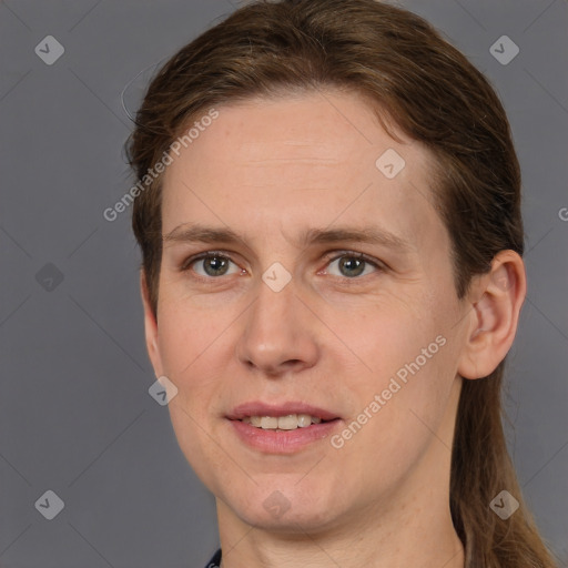 Joyful white young-adult female with short  brown hair and grey eyes