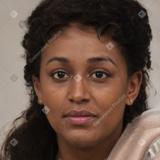 Joyful black young-adult female with long  brown hair and brown eyes