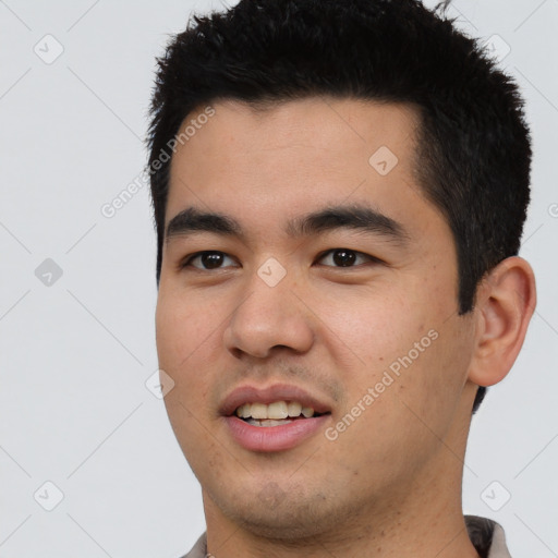 Joyful latino young-adult male with short  black hair and brown eyes