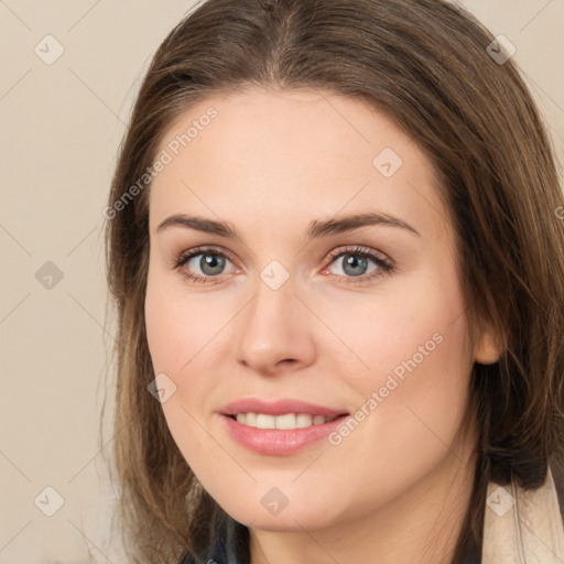 Joyful white young-adult female with long  brown hair and grey eyes