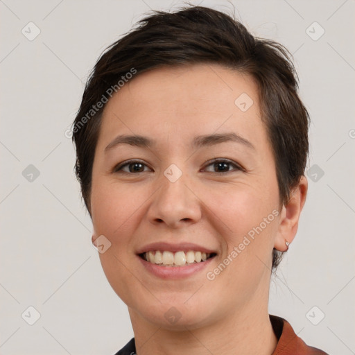 Joyful white young-adult female with short  brown hair and brown eyes