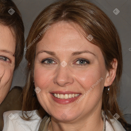 Joyful white adult female with medium  brown hair and blue eyes